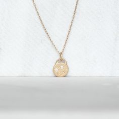 Sweet diamond and gold wildflower necklace. I melted and hammered 2 grams of 14k yellow Gold into an organically shaped disc. I set sparkly white diamonds into the center of wildflowers hand drawn with chasing tools. Hangs from a delicate 1.3mm cable chain with a spring clasp. Pebble - about 10mm x 11mm's, and roughly 2mm's thick Diamonds - 1.7mm Si1 White Diamonds - Conflict-Free Because each pendant is made by hand, no two will be exactly the same. That being said, I am a perfectionist when it Hammered 14k Gold Wedding Necklace, Wedding Hammered 14k Gold Necklaces, 14k Gold Hammered Necklace For Wedding, Delicate Hammered Jewelry For Anniversary, Delicate Hand Forged Gold Jewelry, Delicate Hand Forged Necklace For Gift, Dainty Hammered Recycled Gold Necklaces, Dainty Hammered Recycled Gold Necklace, Delicate Hand Forged Yellow Gold Jewelry