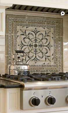 a stove top oven sitting inside of a kitchen next to a wall mounted tile backsplash