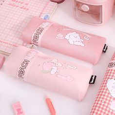 Indulge in sweetness with the Yamako Sweet Peach Pencil Case, radiating charm in vibrant pink hues. Adorned with adorable bunny characters in four delightful designs, it's the epitome of cuteness. Complete with a convenient ring zipper and a pocket for your essentials, it's both practical and adorable. Plus, its themed band adds a stylish touch, whether slipped onto your wrist for easy carrying or wrapped around the pouch for safekeeping. Size: 18.5 cm Material: canvas Binder Paper, Kawaii Pens, Pen Shop, Watercolor Greeting Cards, Adorable Bunny, Sweet Peach, Winter Design, Backpack Tote Bag, Pen Refills