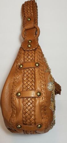 Designer Brown Hobo Bag For Evening, Brown Embellished Luxury Bag, Luxury Brown Embellished Bags, Luxury Embellished Brown Bag, Designer Embellished Leather Shoulder Bag, Designer Handmade Brown Shoulder Bag, Luxury Leather Embellished Shoulder Bag, Luxury Embellished Leather Shoulder Bag, Bohemian Brown Beaded Shoulder Bag