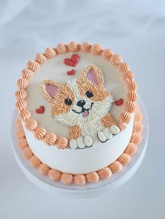 a cake decorated with an image of a dog on the side and hearts around it