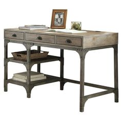 a wooden desk with two drawers and a basket on it's shelf next to a framed photograph