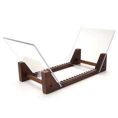 a wooden desk with two mirrors attached to it