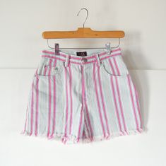 "Brand: Sasson Size: 3/4 (vintage sizes run small so these are more like a modern size 2-please read measurements) cotton Very nice condition Vertical stripes Hot pink light blue and white Sasson Paris New York 80's or 90's era High waist/rise Fray hem edges Cut offs 26 1/2\" waist 36\" hips 11\" front rise 15\" back rise 22\" around thigh at opening 3 1/2 ' inseam" Retro Short Bottoms With Frayed Hem, Retro Cutoff Bottoms For Summer, Vintage Summer Shorts With Belt Loops, Summer Retro Cutoff Bottoms, 90s High-waisted Cotton Shorts, 90s Style High-waisted Cotton Shorts, Vintage Belt Loop Shorts For Summer, Retro Cotton Shorts With Frayed Hem, Retro Bottoms With Frayed Hem For Spring