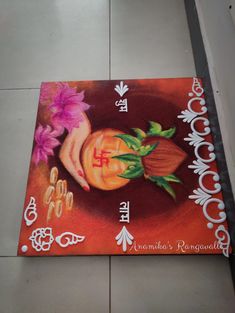 a painting on the floor with flowers and zodiac signs painted on it's sides