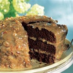 a chocolate cake with caramel icing on a plate