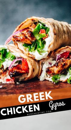 chicken gyros wrapped in pita bread with lettuce and tomato on top