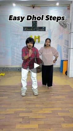 two people standing on a wooden floor with the words easy dhol steps