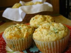 two muffins sitting on top of a colorful plate