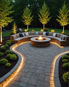 an outdoor fire pit surrounded by landscaping lights