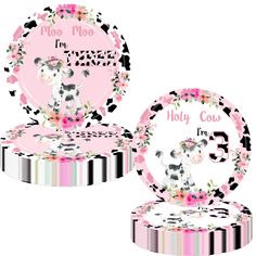 a pink and black cow themed tableware set