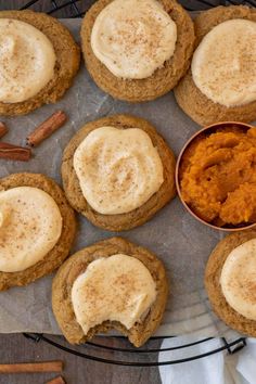 several cookies with frosting and cinnamon on top