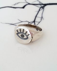 "✤ Sterling silver eye signet ring. ✤ Made of Solid Sterling Silver (925). ✤ The coin is 13X14 mm. ✤ The ring is made to order. If in stock, will ship within 2 days. If not in stock, please allow about 10 days to prepare. ✤ One year warranty ✤ Nickel Free ✤ The ring will be packed in a gift box. ✤ Processing Time is 2-3 business days. I make the jewelry when it's ordered. ✤ Worldwide fast delivery. USA: I ship with NY local USPS \"Priority Mail\"-delivery time 10-19 business days. West Europe: 6 Eye Ring Silver, Teal Necklace, Silver Coin Ring, Emerald Earrings Drop, Blue Pendant Necklace, Protection Ring, Ring Everyday, Emerald Green Earrings, Emerald Earrings Studs