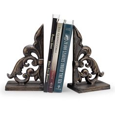 two bookends with books on them sitting side by side in front of each other