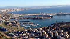 an aerial view of a harbor with boats and ships