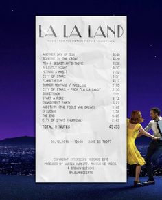 a man and woman dancing in front of a large sheet of paper with the words la la land written on it