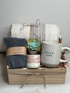 a coffee mug, tea towel and other items are sitting on top of a book