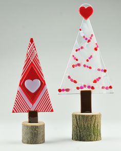 two small christmas trees with hearts on them