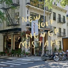 motorcycles parked in front of a building with the words new york never miste written on it