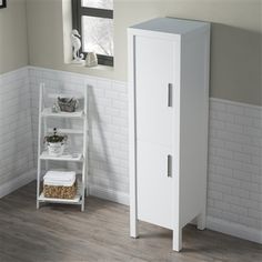 a white cabinet in the corner of a room