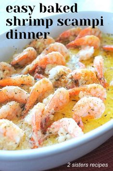 a white bowl filled with shrimp scampi and lemon sauce on top of a table