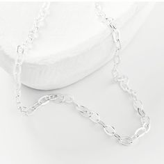 this silver chain can be worn alone as a simple, subtle statement or as a layering piece. Dainty Sterling Silver Chain Necklace For Everyday, Everyday Silver Charm Necklace With Delicate Chain, Everyday White Gold Charm Necklace With Cable Chain, Silver Charm Necklace With Delicate Chain For Everyday, Silver Simple Chain Necklace For Everyday, Simple Silver Chain Necklace For Everyday, Silver Minimalist Charm Necklace With Adjustable Chain, Silver Charm Necklaces With Cable Chain, Sterling Silver Link Charm Necklace