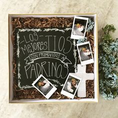 a box filled with pictures and flowers on top of a table