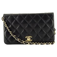 Chanel black lamb leather "Mademoiselle" crossbody bag featuring iconic quilted leather, gold tone hardware with front closure, the iconic signature gold-tone metal and leather interwoven shoulder strap (Length:37.7 in. (96cm)), inside burgundy leather with a flat pocket and inside serial number. - Length: 7.4in. (19cm) - Height: 4.3in. (11cm) - Width: 1.18in. (3cm) Made in France Circa: 2008 In good vintage condition. We guarantee you will receive this gorgeous item as described and showed on p Luxury Black Quilted Wallet On Chain, Classic Wallet On Chain With Gold-tone Logo Plaque, Formal Black Wallet On Chain With Gold-tone Logo, Black Quilted Wallet On Chain For Evening, Formal Quilted Rectangular Wallet On Chain, Quilted Rectangular Wallet On Chain For Formal Occasions, Quilted Rectangular Wallet On Chain For Formal Events, Classic Evening Shoulder Bag With Diamond Quilting, Chic Formal Shoulder Bag With Diamond Quilting