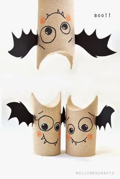 two rolls of toilet paper with faces and bats on them, one is made to look like a bat