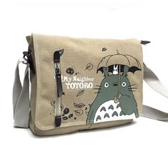 Go on an adventure with Mei, Satsuki and Totoro by using the Totoro messenger bag for all your travels. An elegant, practical and resistant bag that will become your best companion on the road. A small shoulder bag designed for men and women who are regularly on the go and need to carry their personal belongings with them. A small elegant messenger bag with the effigy of your favorite character : Totoro Meet the adorable Totoro character in an original messenger bag featuring the Japanese animat Satchel Shoulder Bag For Outdoor Activities, Outdoor Activities Satchel Shoulder Bag, Casual Satchel Bag For Adventure, Large Capacity Satchel For Adventure, Adventure Canvas Satchel Shoulder Bag, Canvas Satchel Shoulder Bag For Adventure, Portable Canvas Shoulder Bag For Travel, Functional Rectangular Adventure Shoulder Bag, Adventure Shoulder Bag With Adjustable Strap