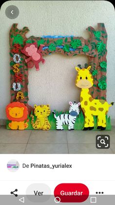 a photo frame made out of paper with animals on it