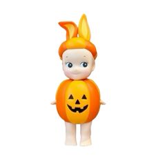 an orange toy with a rabbit on it's head and ears, standing in front of a white background