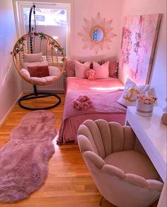 a bedroom with pink bedding and furniture