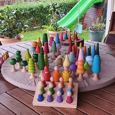 an outdoor play area with wooden toys on it