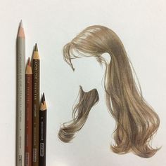 a pencil drawing of a woman's head with long hair and two different colored pencils next to it