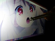 a person is drawing on a computer screen