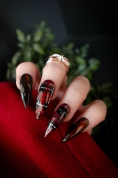 Black and red plaid nail inspo for long stiletto nails  ft. Getaway Shadowed, Double Down, Grand, Cat's Eye 10, Blackout, Noire Red And Black Christmas Nails, Black And Red Christmas Nails, Dark Winter Nails, Christmas Sweater Nails, Flared Nails, Deep Red Nails, A Touch Of Darkness, Touch Of Darkness, Stilleto Nails Designs