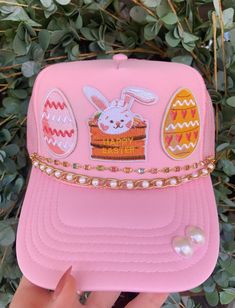 The cutest hat this Easter!! Adjustable back hat. Chains are removable and interchangeable with clasps on each end to fit on any netted trucker hat. Please allow up to a week for your order to ship as this is a custom piece. Pink Mini Baseball Cap For Parties, Pink Baseball Cap Mini Hats For Party, Pink Snapback Baseball Cap For Party, Cute Pink Festival Hat, Pink Baseball Cap For Party, Pink Adjustable Baseball Cap For Party, Spring Pink Mini Cap Hat, Trendy Pink Party Baseball Cap, Pink Trucker Hat For Spring Party