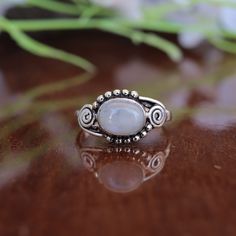 This beautiful stacking ring features a genuine moonstone gemstone in a oval design. Our blue fire moonstone is cut in a eclipse brilliant cut, which has an intense blue color with a hint of red undertones, and will add an elegant touch to any look. This makes the perfect engagement ring or bridal set, or can be worn as an everyday piece. The Product Specification Are As Below : Stone - Moonstone Stone Shape - Oval About Gemstone- Moonstones' healing properties help against nosebleeds, headaches, sunstroke, and epilepsy. These gemstones are also believed to help with the menstruation cycle and increase fertility. Unique design of this ring will make a special attraction for the wearer. Your order will dispatch within 2 days and you will receive it asap. For more Exciting and beautiful ring Christmas Ring, Gift For Mom Christmas, Ring Moonstone, Moonstone Stone, Unique Holiday Gifts, Mom Christmas, Minimalist Ring, Ring Oval, Blue Fire