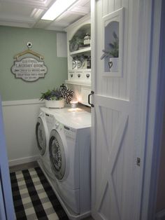 a washer and dryer in a room with a black and white checkered floor