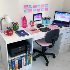 a desk with a computer, printer and other office supplies on it's top