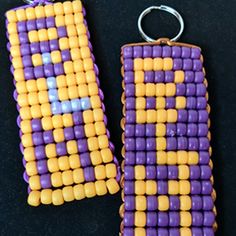 two purple and yellow beaded earrings on a black surface, one with an earring