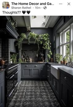 a black and white kitchen with green plants on the window sill above the stove