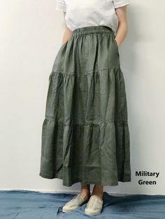 "Absolute go-to fluttering long skirt made with soft linen, charming and comfortable. This fantastic tiered and ruffled skirt will add more feminine look to your outfit. It swings with your movement and the linen fabric makes it more airy and flowy. -100% Linen and handmade -Tiered and ruffled -Flexible elastic band waist -Two welt pockets - Ankle length - Listing Colors: Terracotta, Natural, Military Green, Taupe, Black, Penn Blue. Please provide your natural waist, lower hip measurements and y Long Navy Skirt, Tiered Skirt Outfit, Ruffled Long Skirt, Tiered Skirt Pattern, Tiered Long Skirt, Long Tiered Skirt, Long Linen Skirt, Linen Slip Dress, Skirt Tiered