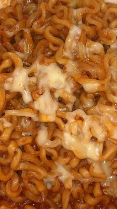 a close up view of some noodles with cheese