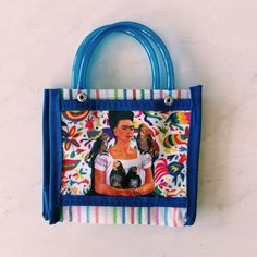 We are Mexican Designers and love to share our culture. This market bag is representative of Oaxaca, Mexico artisanal designers. Since they are made out of plastic, these are durable, unique, and stand out bags. This wonderful new tote has a variety of printed out images of famous Mexican artist Frida Kahlo. It brings out a chic side to a market bag, making it a unique and iconic purse. Use this bag for a picnic, as a gift bag for parties, or even as a summer purse to make your look stand out. W Summer Purse, Summer Purses, Traditional Market, Mexican Designs, Mexican Artists, Linear Pattern, Market Bag, Bag Handle, Tote Purse