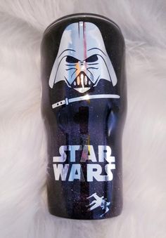 a star wars themed coffee mug with darth vader on it's side