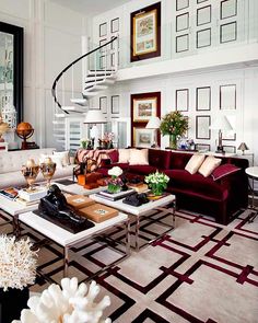 a living room filled with furniture and a spiral staircase