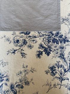 the blue and white flowers are on the fabric