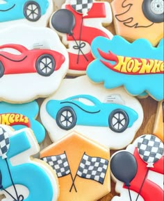 cookies decorated like cars and motorcycles on a table